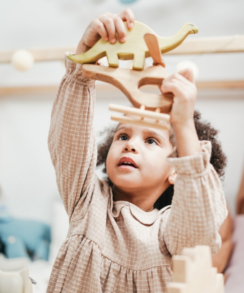 girl-in-white-and-brown-stripe-hoodie-raising-her-hands-with-3662709