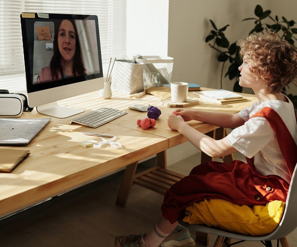 photo-of-child-watching-through-imac-4145038